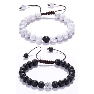 Close-up of adjustable braided lava stone and white turquoise couple bracelets