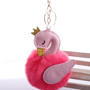 Detail of rose pink swan faux fur keychain with golden crown and metal lobster clasp
