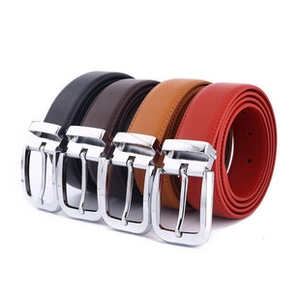 Detailed stack of women's belts in black, coffee, brown, and red with silver buckles