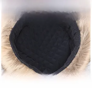Detail of warm quilted lining and soft faux fur trim on winter trapper hat for men