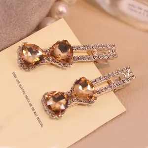 Barrettes à cheveux élégantes en alliage doré avec cristaux de cœur ambre et strass