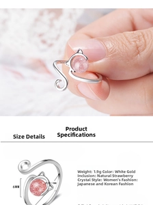 Detail view of cat-shaped silver ring featuring pink strawberry crystal and dimensions