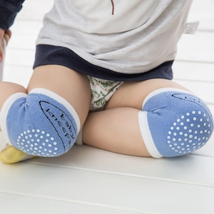 Breathable baby crawling knee pads in light blue with non-slip silicone dots