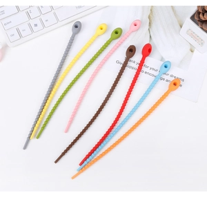 Close-up of multi-colored silicone cable ties with ribbed texture for organizing