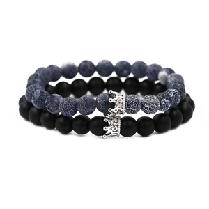Crown beaded bracelet set with blue crackle stone and matte black beads on white background