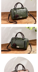 Detail view of retro oil wax leather Boston bag with decorative rose charm and adjustable strap