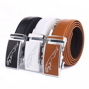 Detail view of leather belt set in black, white, and brown with leopard metal buckle