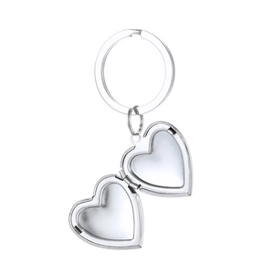 Polished silver heart-shaped photo locket keychain with open frame on white background