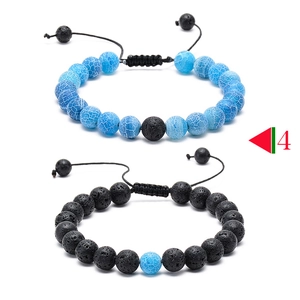 Detail view of adjustable woven lava stone and turquoise beaded bracelets for couples
