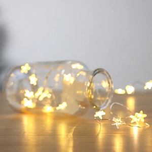 Warm white LED star copper wire string lights for cozy indoor Christmas home decoration