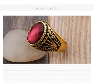 Detail view of vintage 18K gold plated men's ring with large red ruby zircon stone