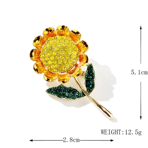 Golden sunflower brooch with yellow and green rhinestones, 5.1cm height, on white background