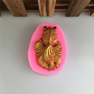 Pink silicone koi fish mold for chocolate and fondant cake decoration with gold fish sample
