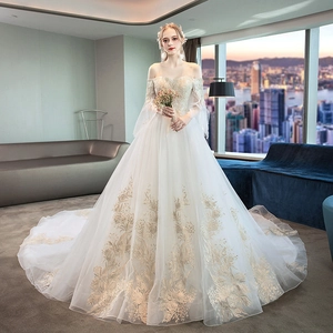 Elegant ivory off-shoulder wedding dress with champagne floral lace and long train