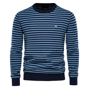 Close-up of blue and black striped knit sweater texture and crew neckline detail