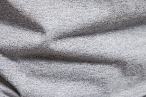 Detailed macro view showing the soft gray heather cotton knit fabric texture and fibers