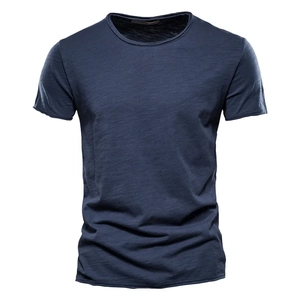 Detail of navy blue slub cotton t-shirt fabric showing textured weave and round neck