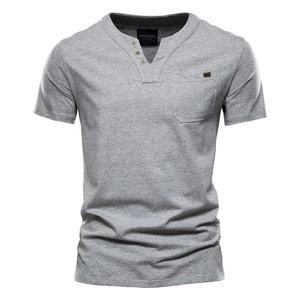 Detail of grey cotton blend Henley shirt showing the chest pocket and premium texture