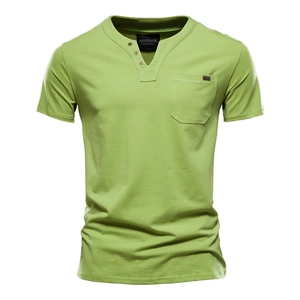 Detail of green cotton Henley shirt showing high-quality knitted fabric and chest pocket