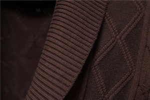 Detailed view of dark brown V-neck knit cardigan with ribbed collar and diamond textures