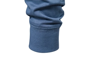 Close-up of ribbed cuffs and stitching on the gray-blue knit long-sleeved t-shirt