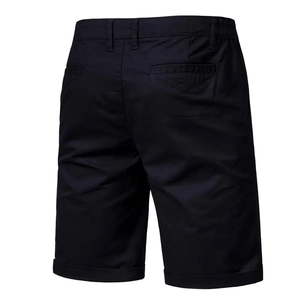 Detail view of cotton shorts back pockets and stylish rolled hem in dark navy