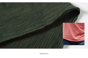 Detailed view of durable double-stitched hem on a breathable slub cotton t-shirt