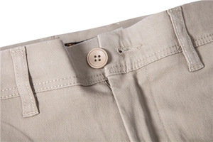 Detailed close-up of khaki cotton chino waist with precise stitching and button closure