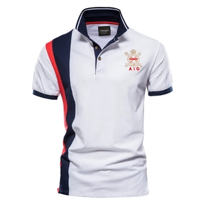 Detail of white cotton polo shirt featuring red and navy side stripes and embroidery