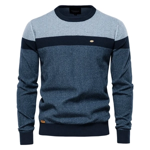 Detailed view of striped crewneck sweater with blue patchwork knit texture and ribbed collar