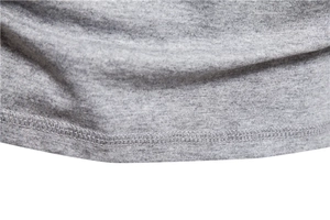 Detail of grey melange cotton fabric texture and double-needle hem stitching on men's T-shirt