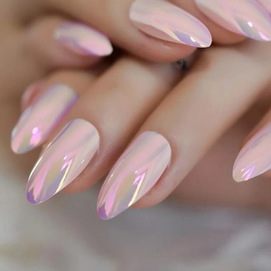 Macro shot of iridescent aurora nail powder showing pink holographic shine on almond nails