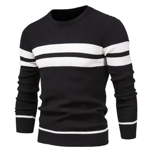 Close-up of the black and white striped knit texture and round neckline of the men's sweater