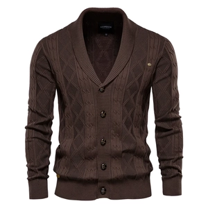 Close-up of dark brown knit cardigan featuring premium ribbed texture and button closure
