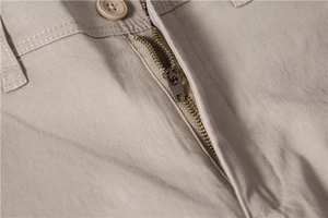 Close-up of premium twill cotton trousers with smooth metal zipper and reinforced stitching