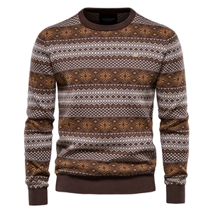 Detail of vintage jacquard snowflake pattern on brown men's knitted sweater