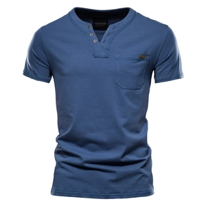 Detail of blue cotton Henley T-shirt featuring a chest pocket and three-button neckline