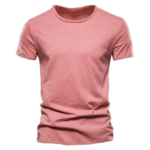 Close-up of slub cotton texture and classic crew neck on pink short sleeve men t-shirt