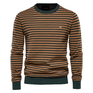 Close-up of crew neck knit sweater with striped pattern and detailed fabric texture