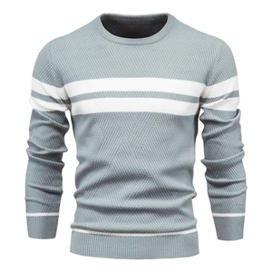 Detailed view of gray-blue knit sweater featuring white stripes and textured patterns
