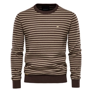 Detailed view of striped knit texture and ribbed neckline on crewneck sweater