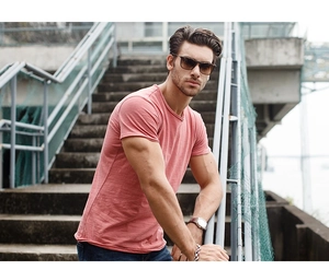 Detail of dusty pink slub cotton T-shirt featuring a ribbed crew neck and textured fabric