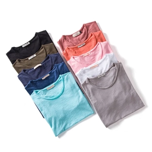 Flat lay of colorful crew neck T-shirts in slub cotton showing soft fabric texture