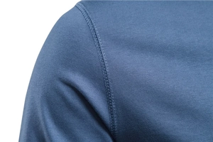 Detail shot of navy blue long sleeve T-shirt showing reinforced shoulder stitching