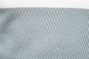 Detailed macro view of the grey-blue and white striped knit texture on men's sweater
