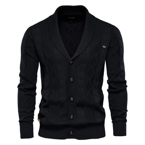 Close-up of black V-neck cardigan showing intricate diamond knit texture and button detail