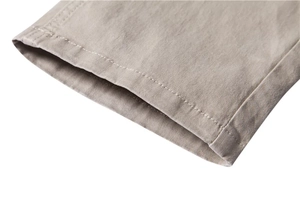 Close-up of khaki twill trousers showing high-quality double-stitch sewing details