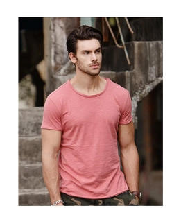 Close-up of pink slub cotton T-shirt showing detailed fabric texture and crew neck