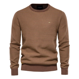 Close-up of the ribbed crew neck and brown striped knit texture on a men's sweater