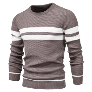 Detail of men's brown knit sweater showing white stripes and ribbed crew neck texture